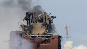firefighters battle a fire after an explosion